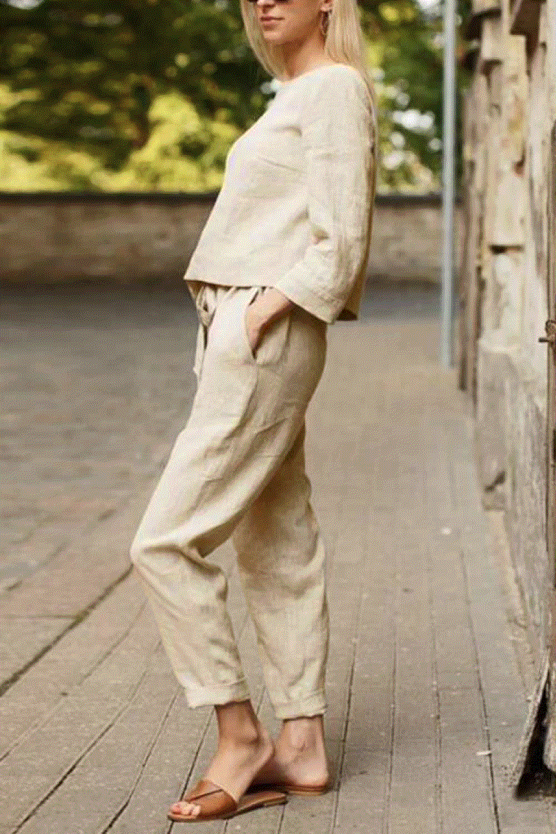 Woman wearing a 100% cotton linen monochrome two-piece set with loose-fitting top and pants.