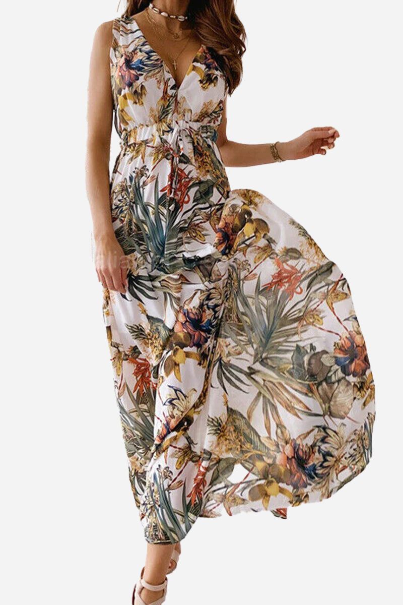 Woman wearing a floral casual sleeveless dress with a flowing skirt and v-neckline