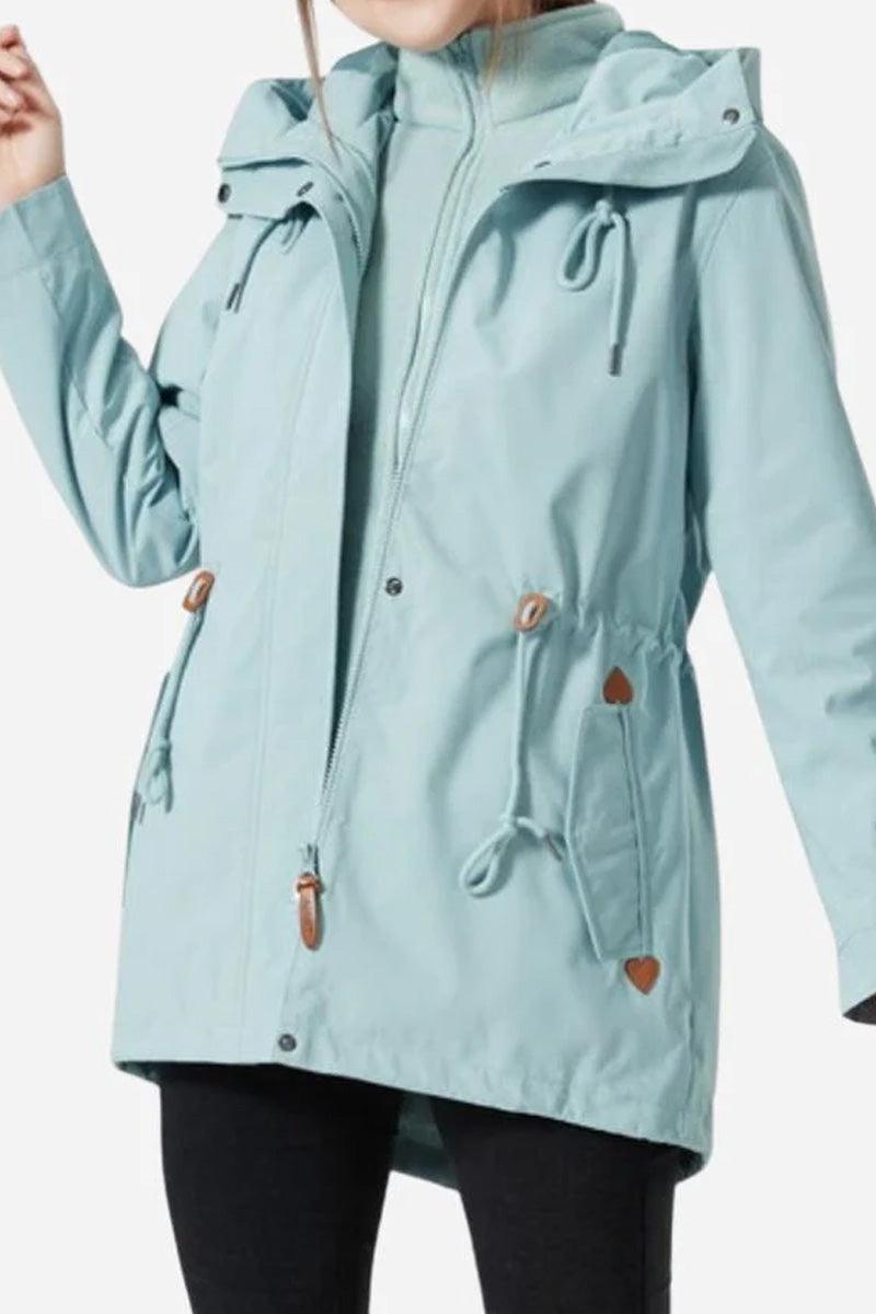 Light blue Versatile Chic Two-Piece Windbreaker Set with adjustable hood and drawstring waist, worn over fleece liner.