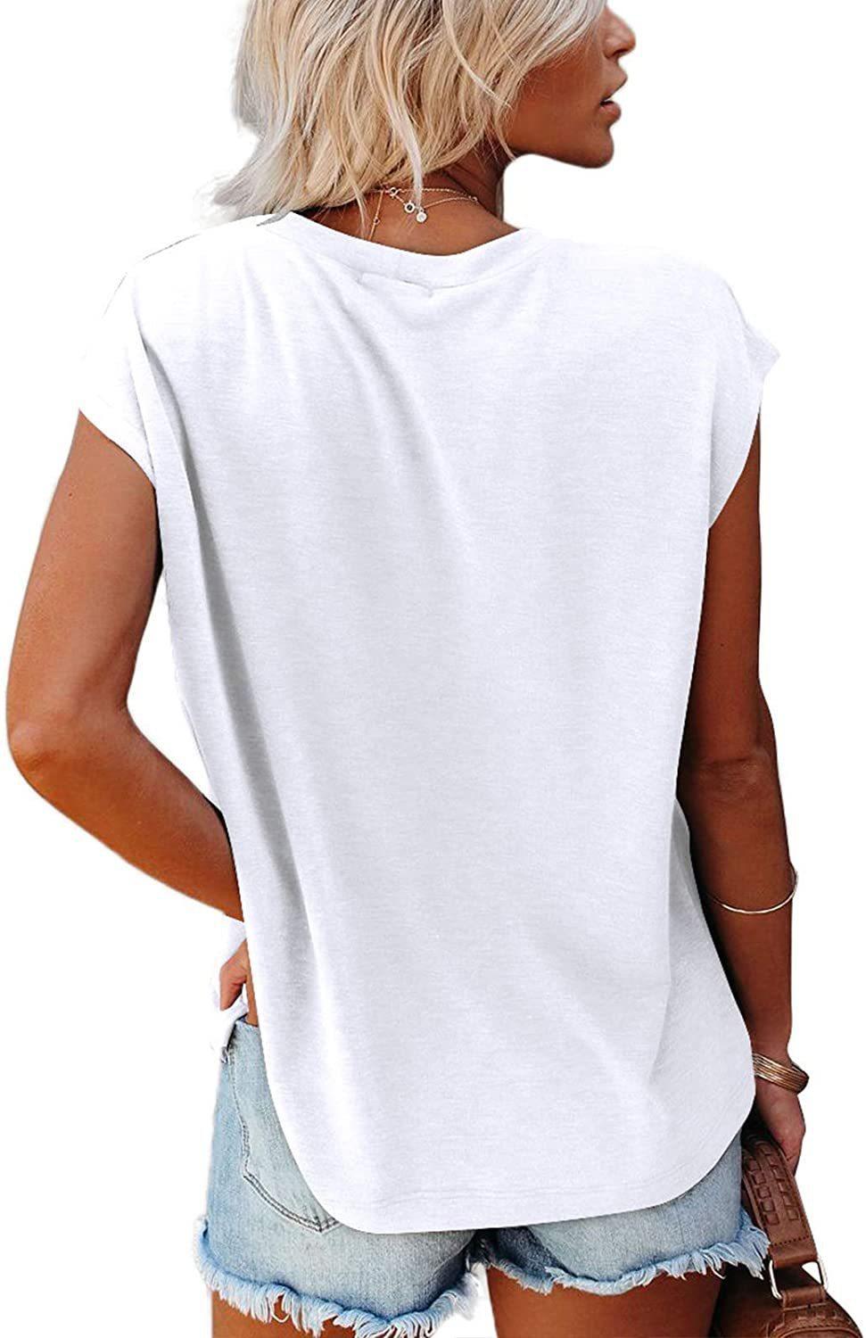 Woman wearing a white Easy Breezy Tunic Shirt with cap sleeves and relaxed fit, paired with denim shorts, back view