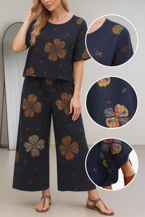 Women's loose fit co-ord set with short sleeves and wide-leg pants in navy blue floral print, relaxed and breathable fabric.