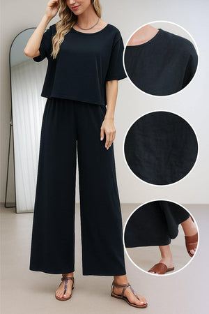 Black loose fit co-ord set with relaxed short sleeve top and wide-leg trousers in soft, breathable fabric.
