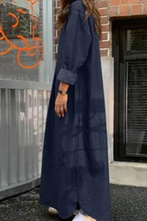 Woman wearing a navy blue body-balancing, temperature-controlled bohemian maxi dress with long sleeves, standing outdoors.