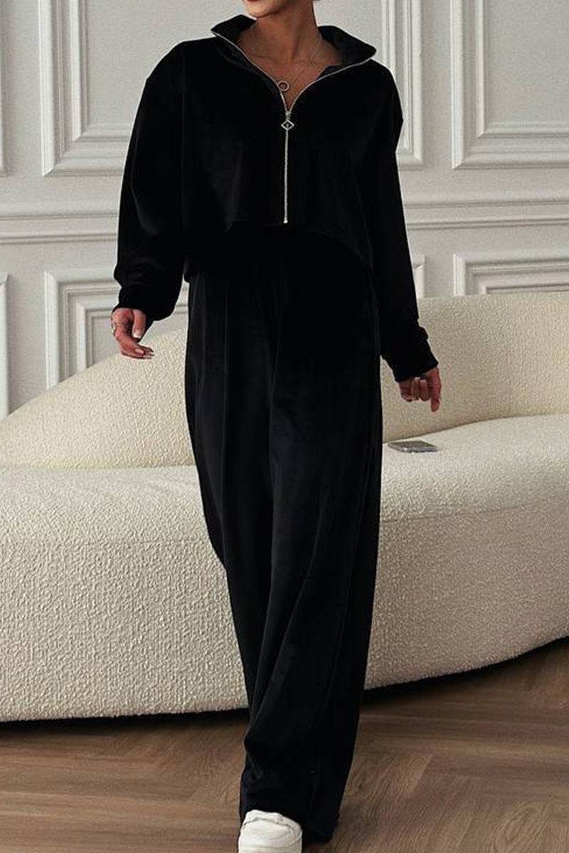 Woman wearing black zip up wide leg pants leisure two-piece co-ord in cozy velour fabric