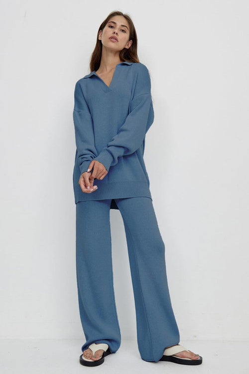 woman wearing blue plush and preppy two-piece set with polo collar and wide-leg pants