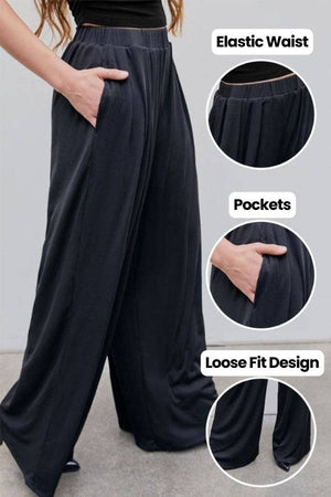 Black stretchy wide-leg pants with elastic waist, pockets, and loose fit design for all-day comfort and style