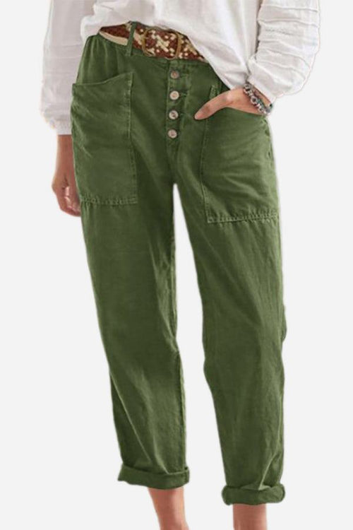 Green casual button-down utility-chic trousers with deep pockets and rolled cuffs worn with white shirt