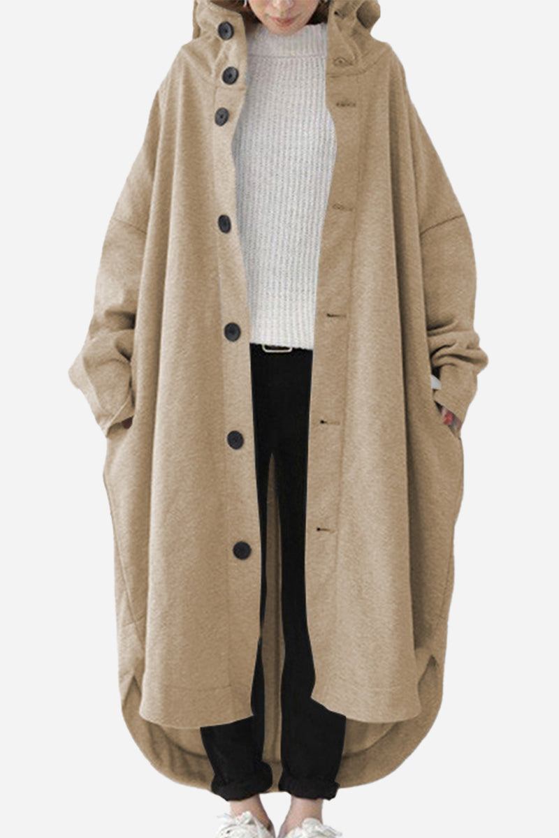 Oversized beige buttoned hooded coat worn over casual outfit, lightweight and roomy fit.