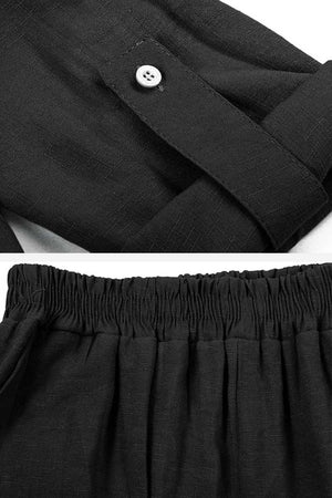 Close-up of black cotton blend two-piece set showing buttoned cuff and elastic waistband details