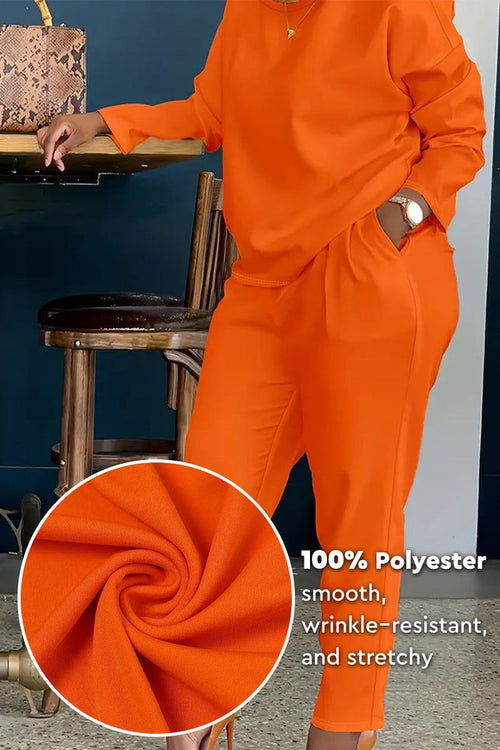 All-Day Comfort 2-Piece Outfit Set in bright orange, smooth wrinkle-resistant polyester fabric, relaxed fit with long-sleeve top and pants.