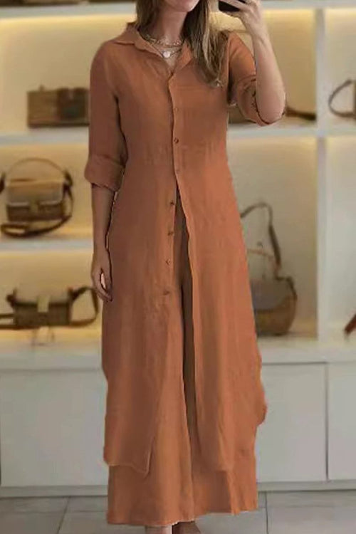 Woman wearing rust-colored refined comfort coordinated wide-leg two-piece outfit with long button-up top and matching pants