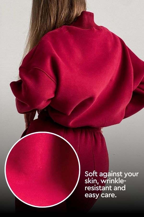 Woman wearing red Storm Sweater Mock Neck athleisure set, soft wrinkle-resistant fabric close-up