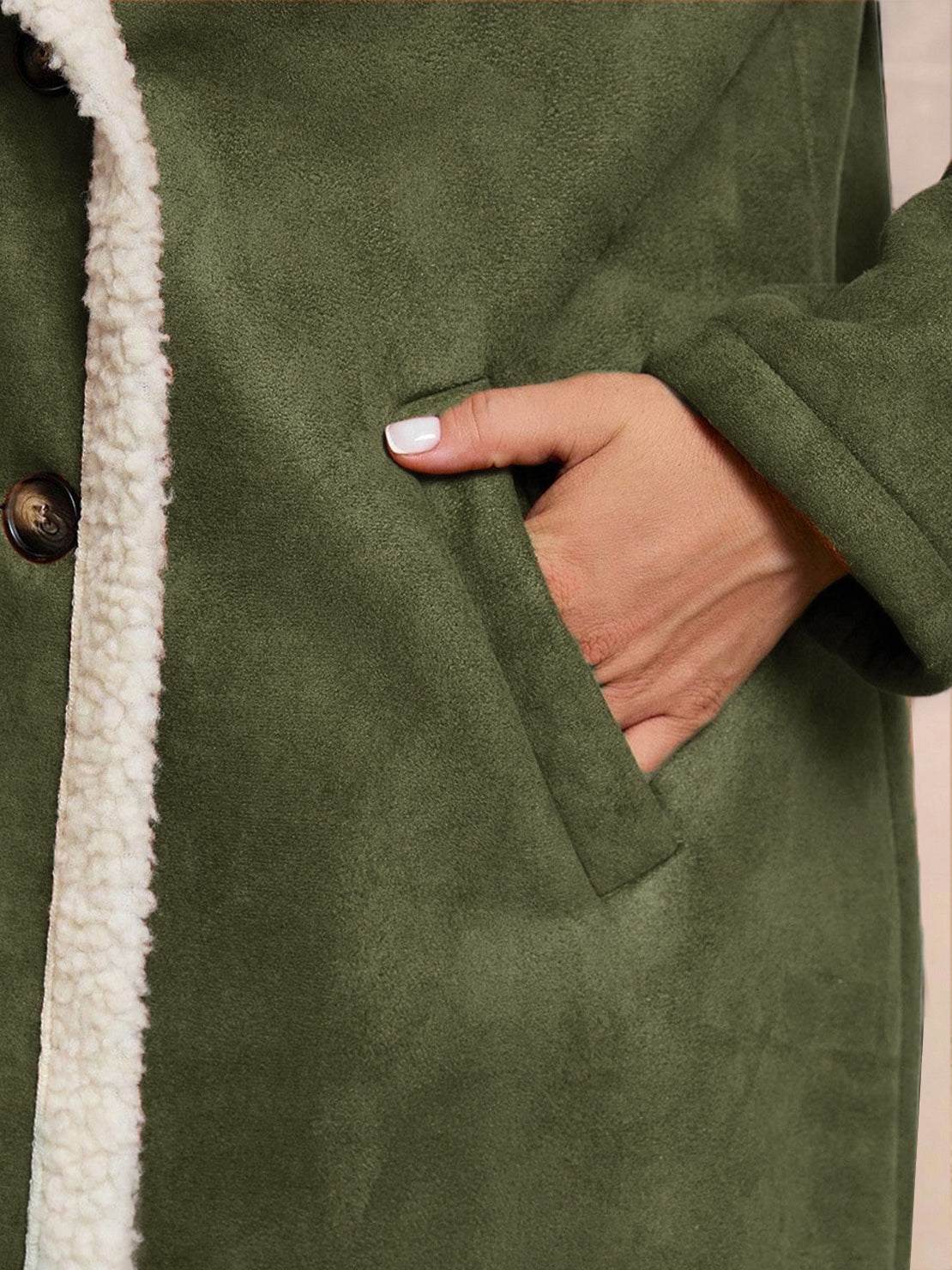 Faux suede sherpa coat with mid-thigh length, double-breasted front, and contrast sherpa trim.