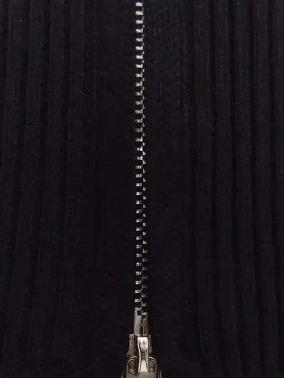 white ribbed zip-up knit cardigan jacket with high neckline and long sleeves on wooden hanger