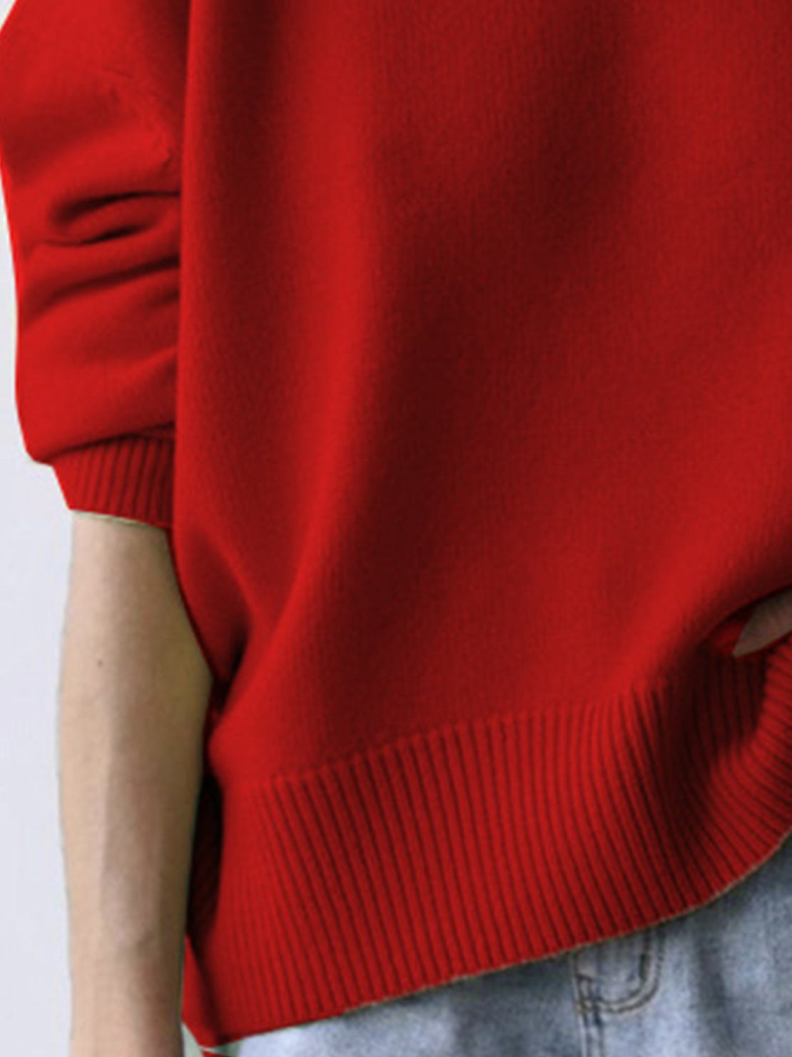 Oversized crew neck knit sweater with drop-shoulder sleeves and ribbed cuffs