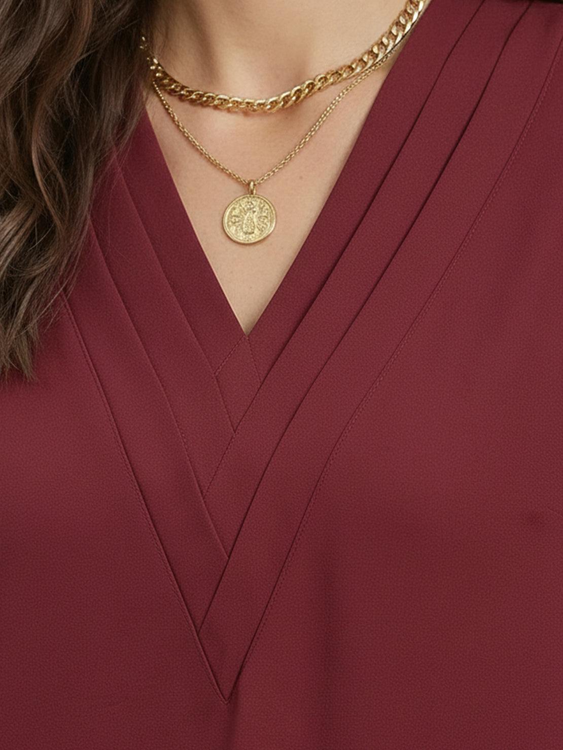 white pleated v-neck long-sleeve blouse with button cuffs and relaxed fit