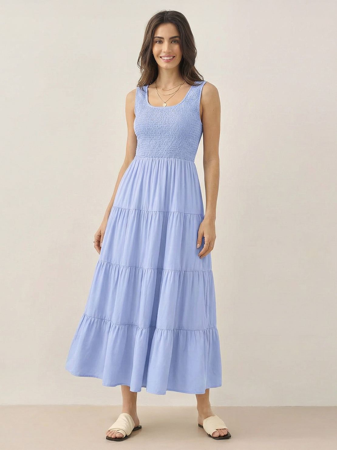 Smocked sleeveless maxi dress with tiered skirt and scoop neckline