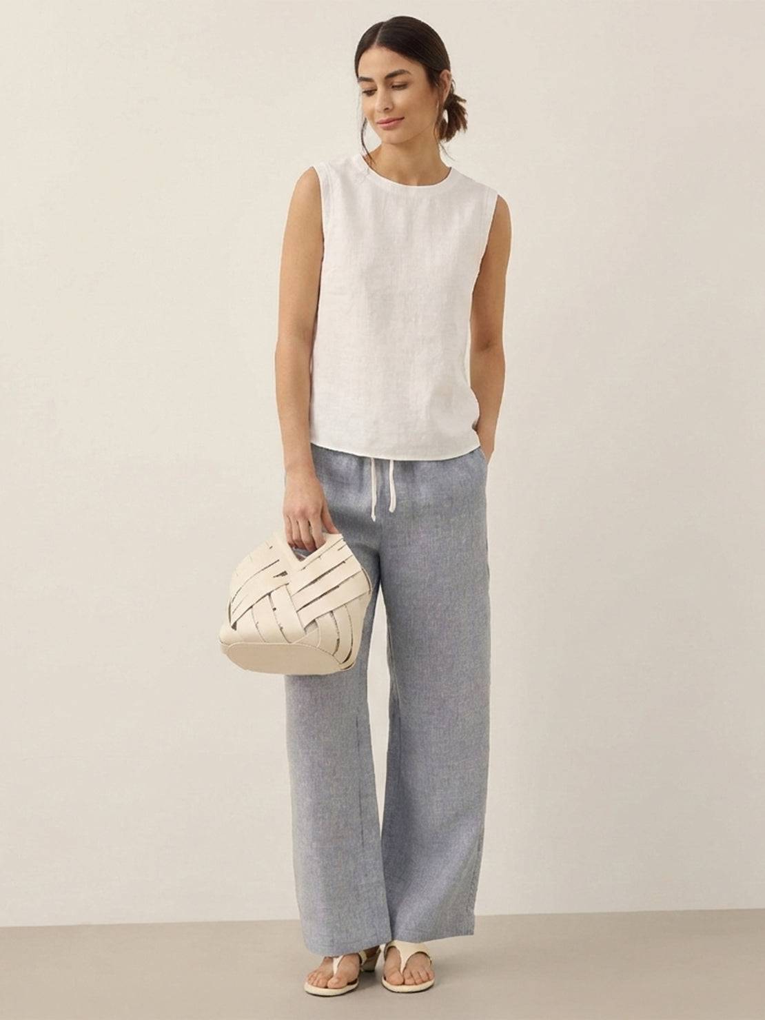 100% cotton-linen sleeveless top with round neckline and back button closure