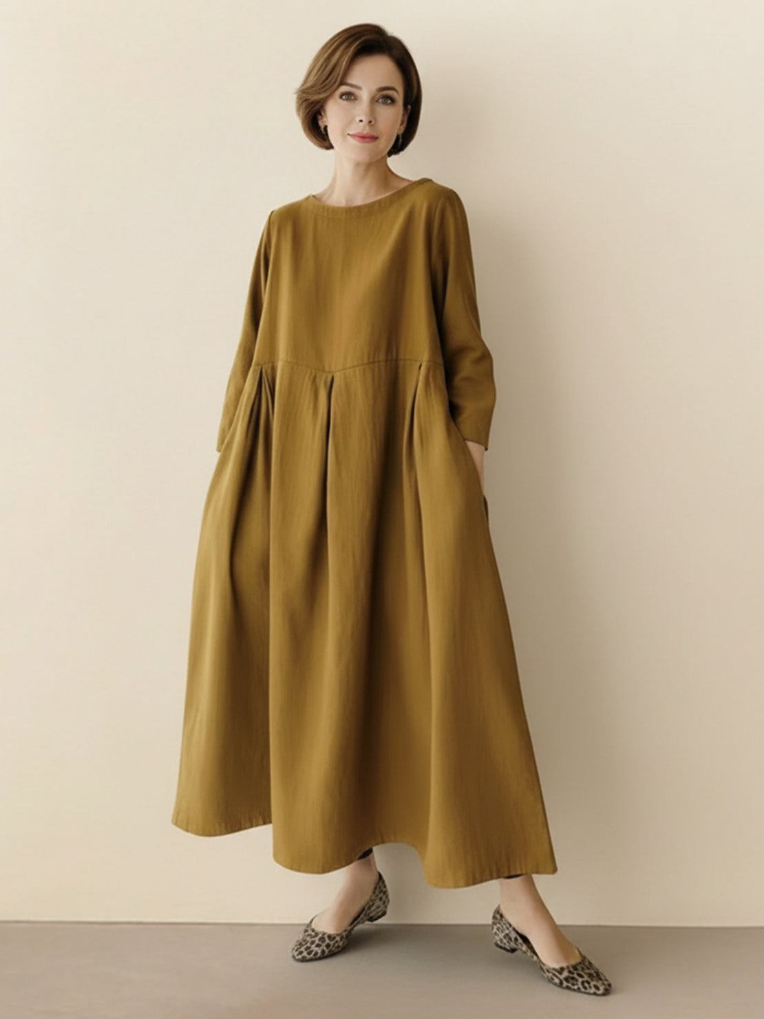 Cotton-linen empire waist dress with natural crinkle texture and A-line maxi silhouette