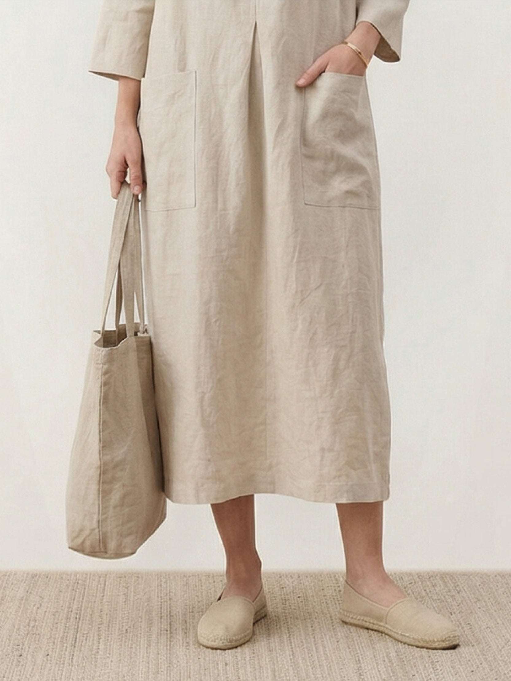 100% linen A-line maxi dress with 3/4 sleeves and front patch pockets