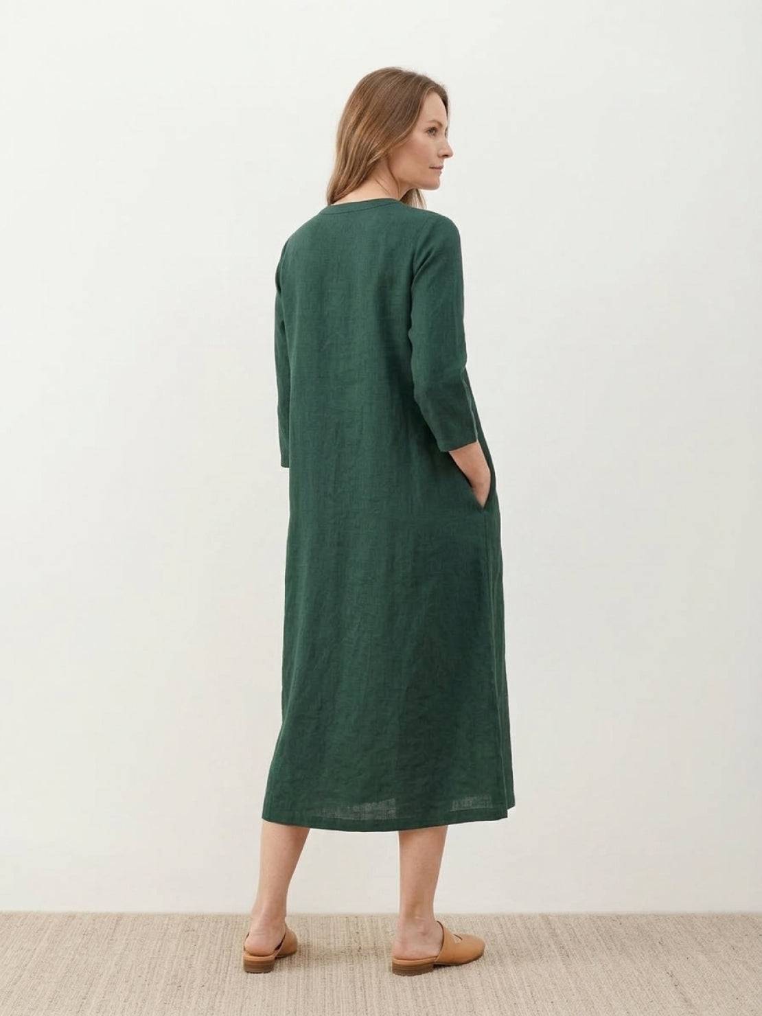 Relaxed A-line cotton linen dress with vertical pintuck pleats, 3/4 sleeves, side slits, and breathable fabric