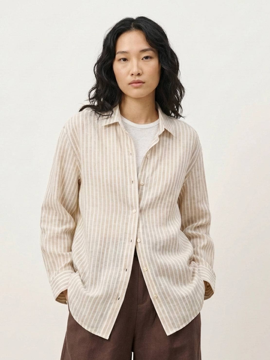 100% linen pinstripe shirt with loose fit, drop shoulders, long sleeves, and curved hem