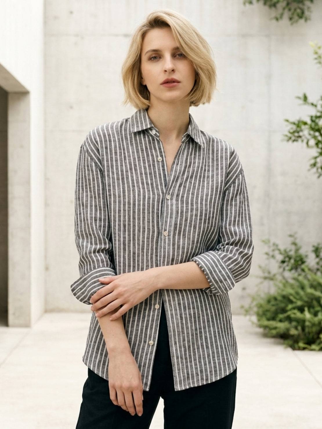 100% linen pinstripe shirt with loose fit, drop shoulders, and curved hem