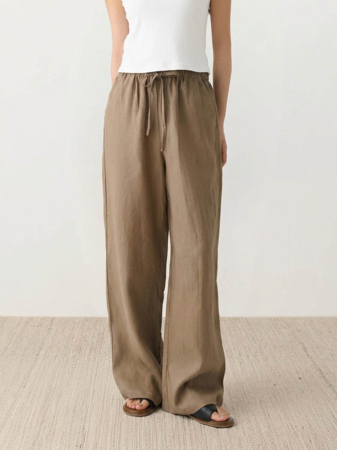 100% linen wide-leg pants with high-rise elastic waist and side pockets