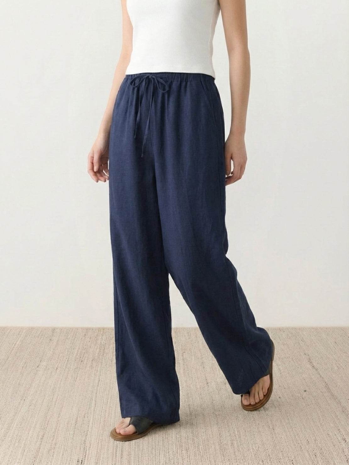 100% linen wide-leg pants with high-rise elastic waistband and side pockets