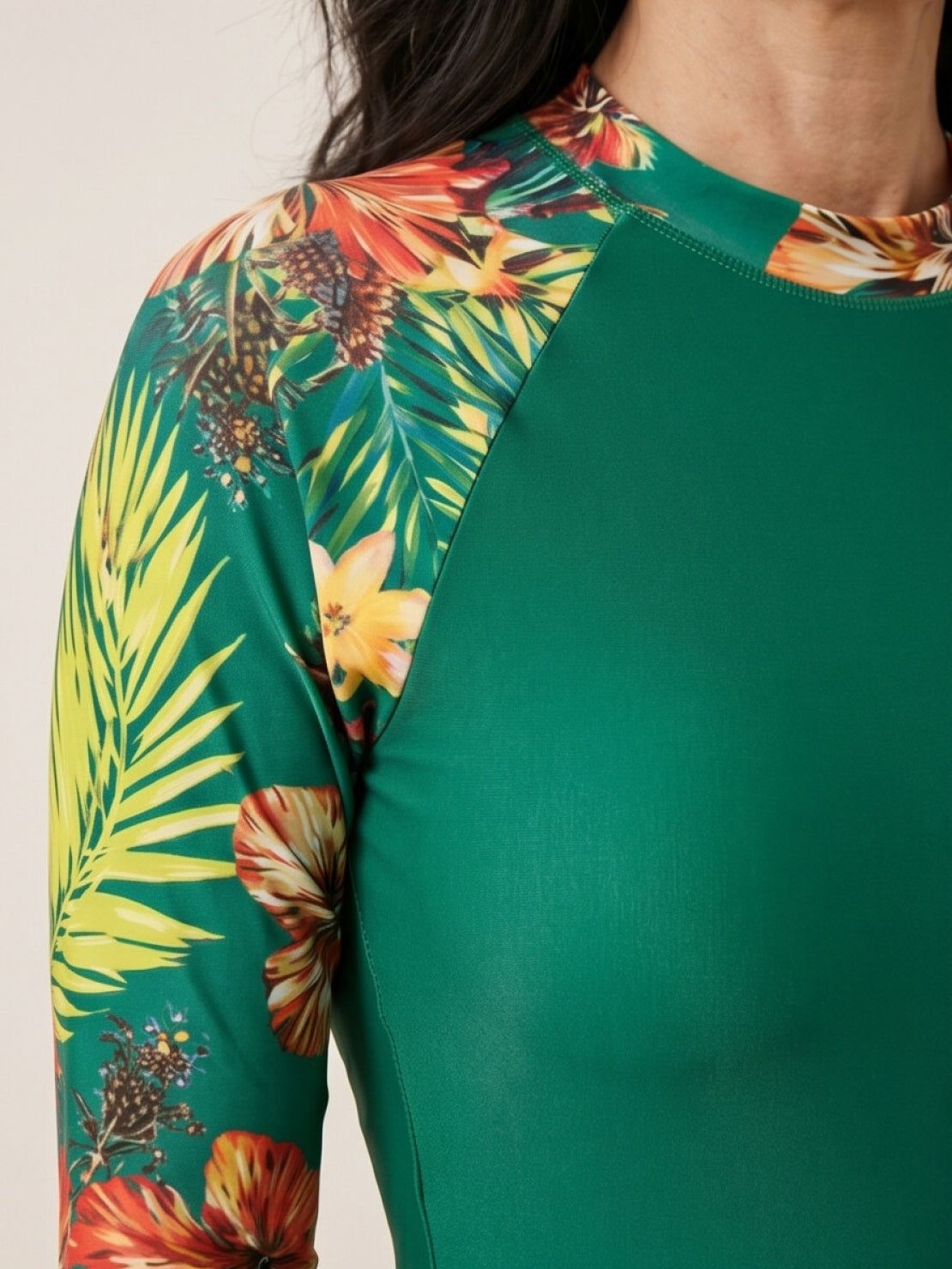 Two-piece tropical print rash guard set with long sleeves and boy-cut shorts