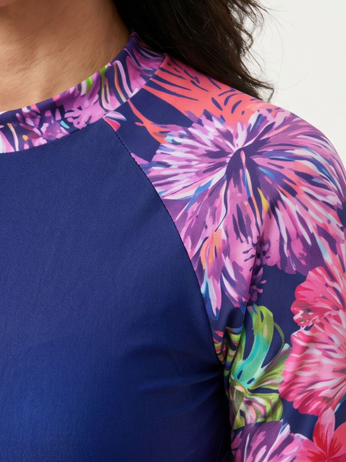 Tropical print rash guard set with long sleeves, high neckline, and adjustable boy-cut swim shorts