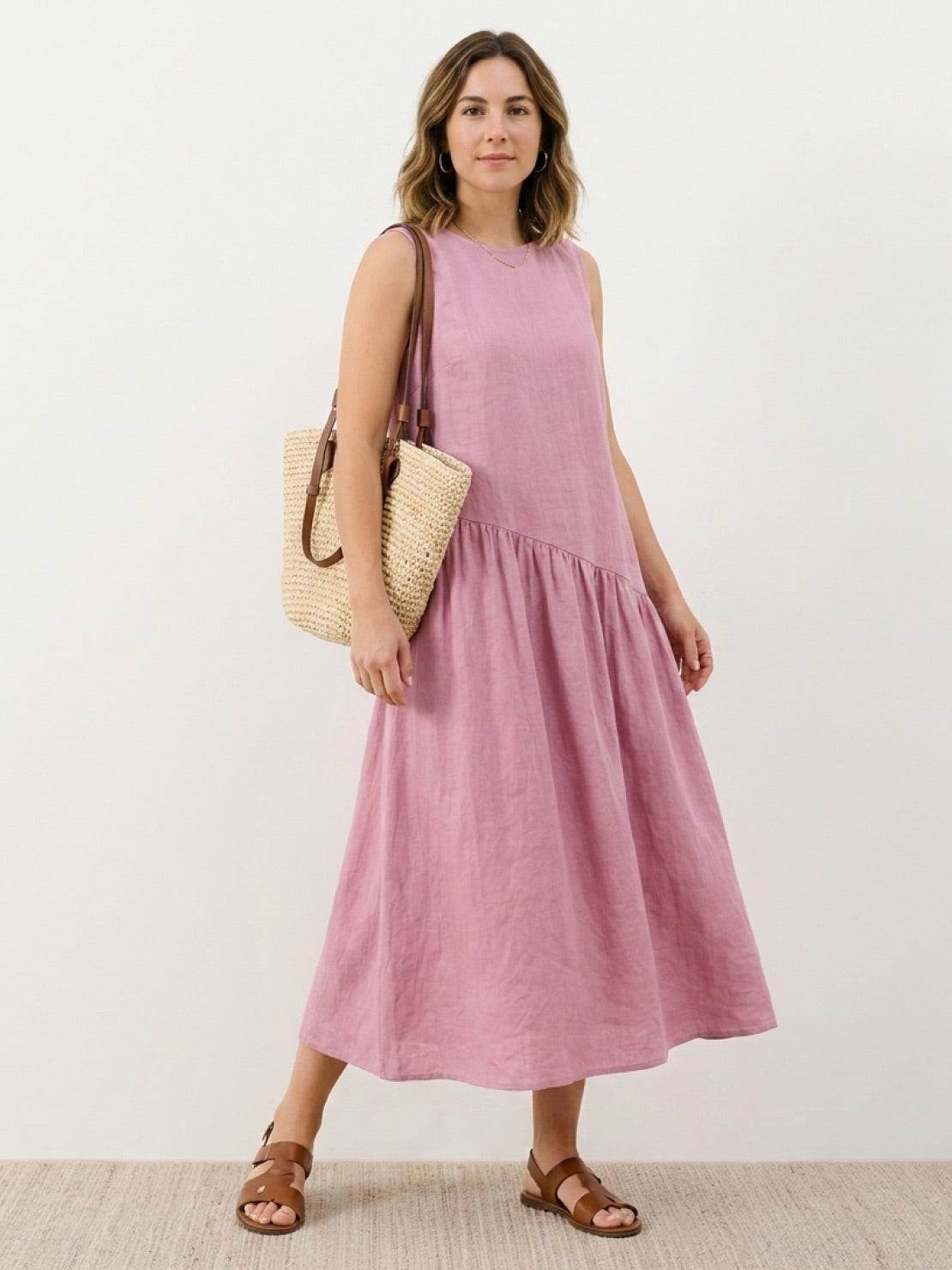 Lightweight cotton-linen summer midi dress with tiered skirt and relaxed drop-waist silhouette in natural fabric texture