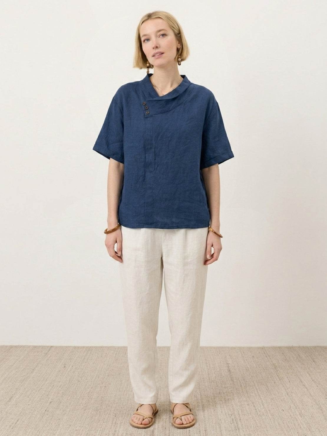 100% linen relaxed V-neck top with asymmetric button detail and short sleeves