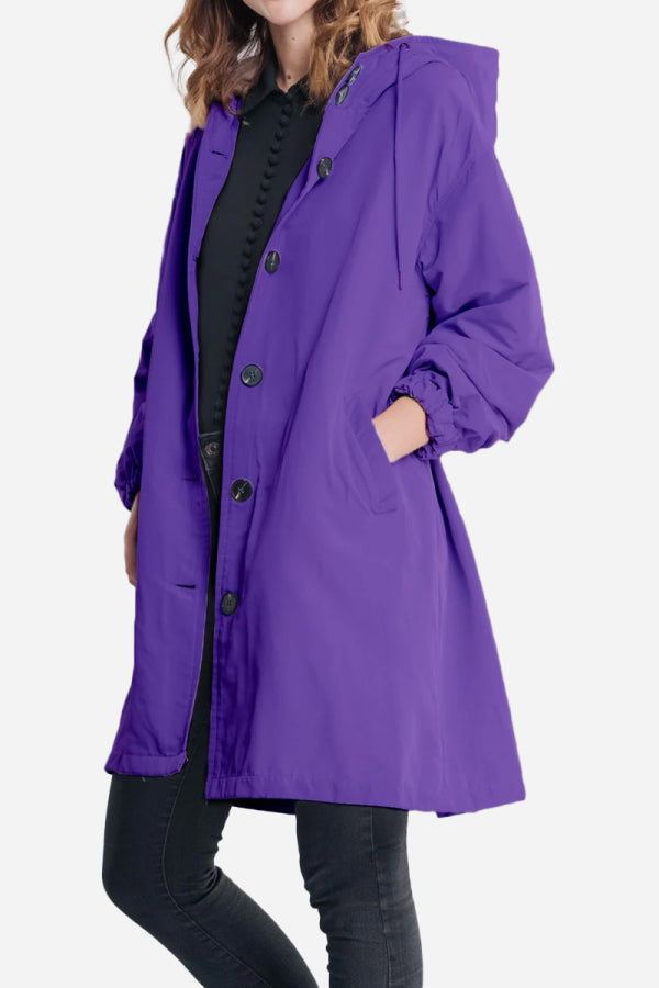 Purple water resistant oversized windbreaker jacket with hood and button closure for women