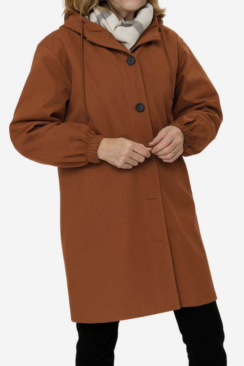 Water resistant oversized hooded brown windbreaker rain jacket with button closure and elastic cuffs