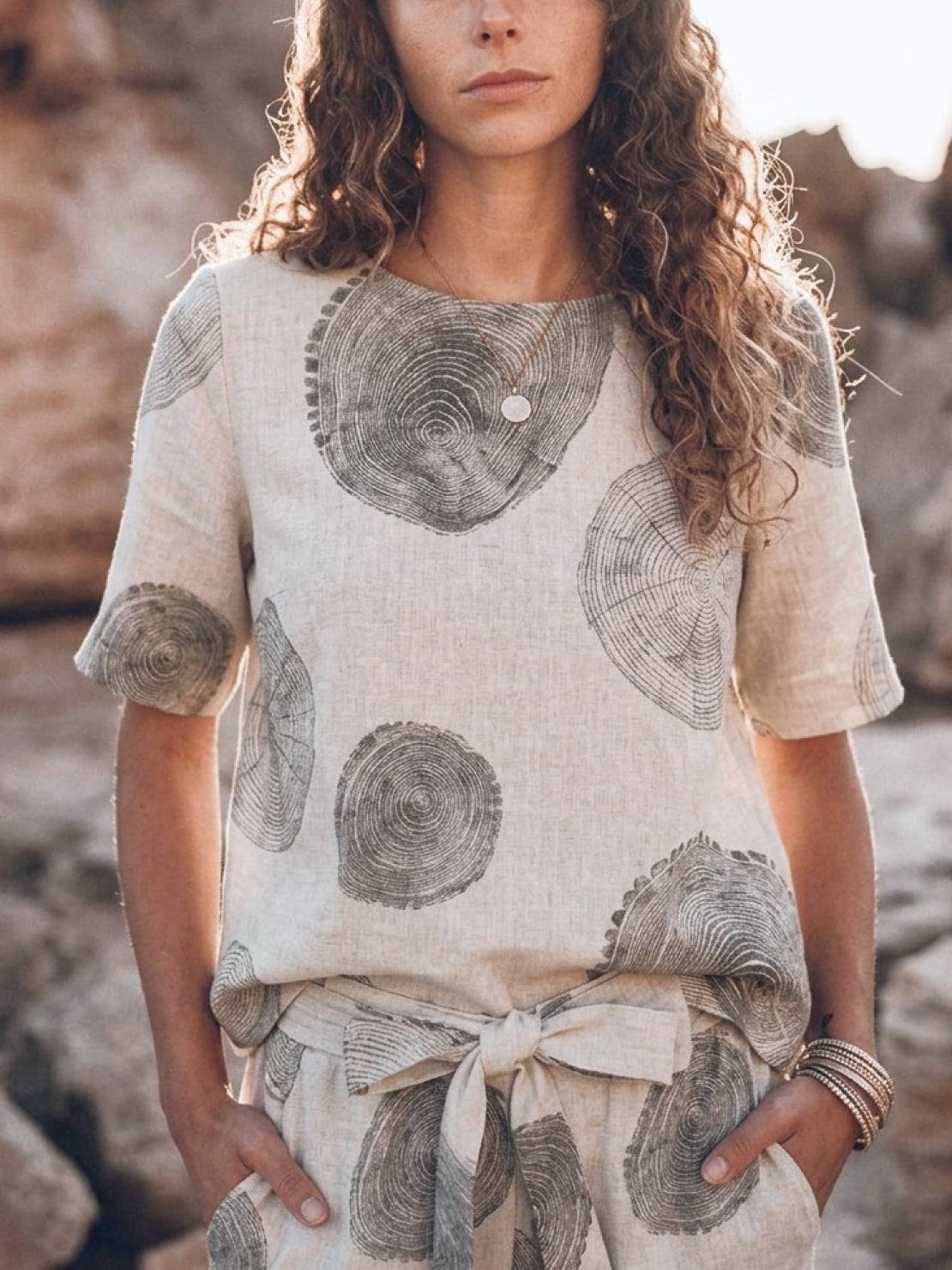 Woman wearing a relaxed cotton-linen set with short-sleeve top and straight-leg pants in a monochrome palette