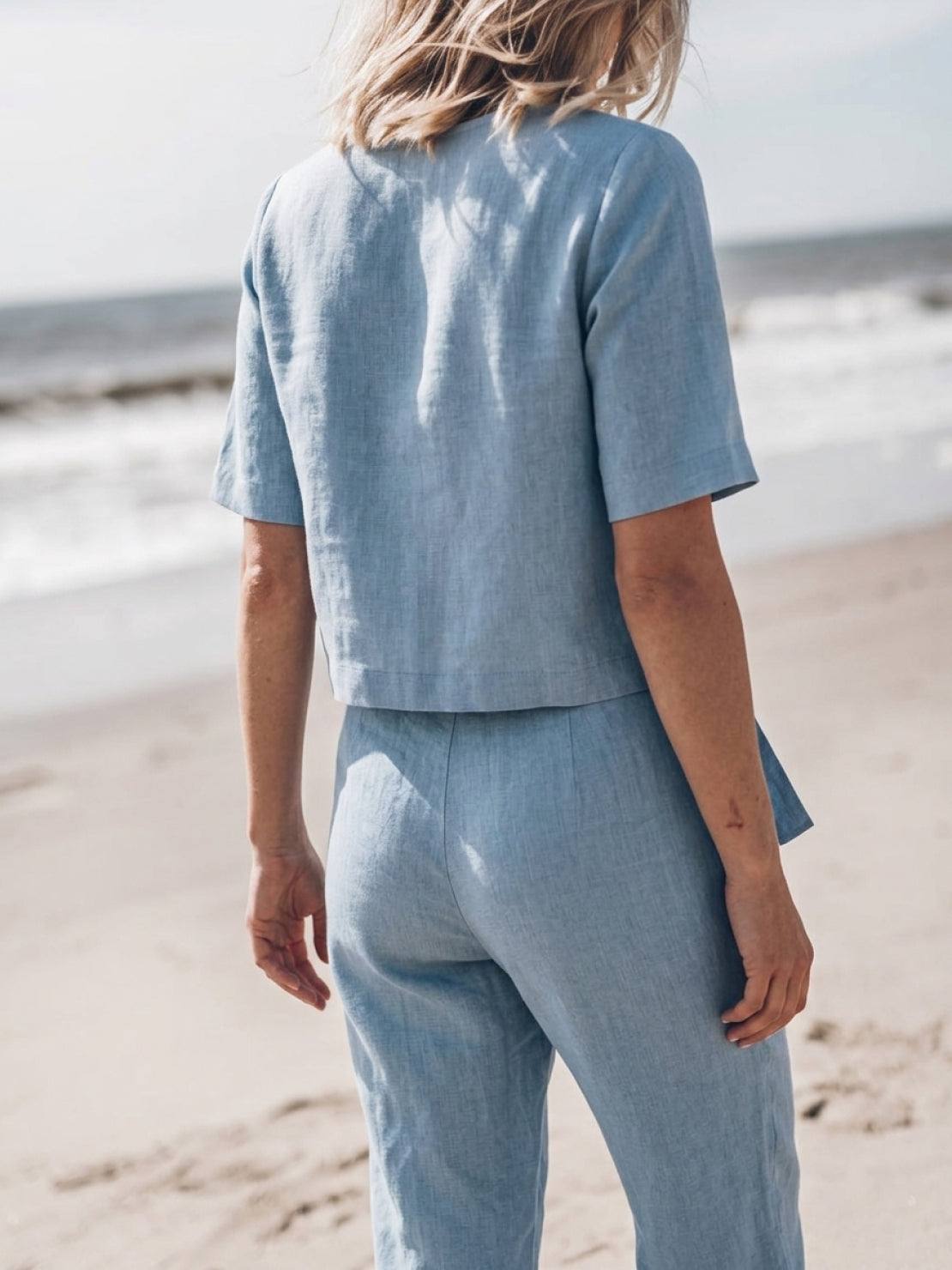 woman wearing relaxed cotton-linen set with short-sleeve top and straight-leg pants in monochrome tones
