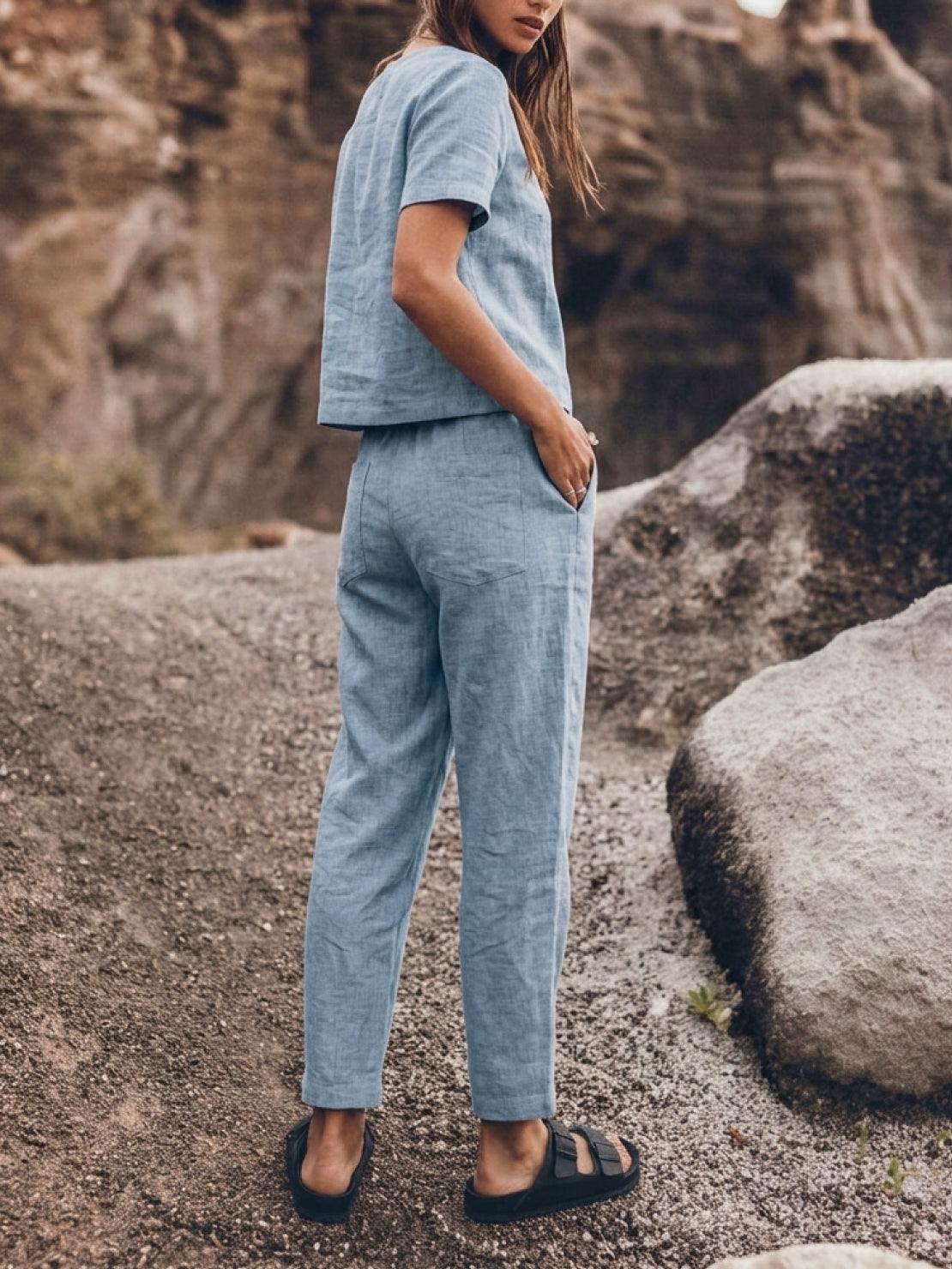 Cotton-linen set featuring relaxed short-sleeve top and straight-leg pants in a breathable, soft monochrome fabric with natural texture.
