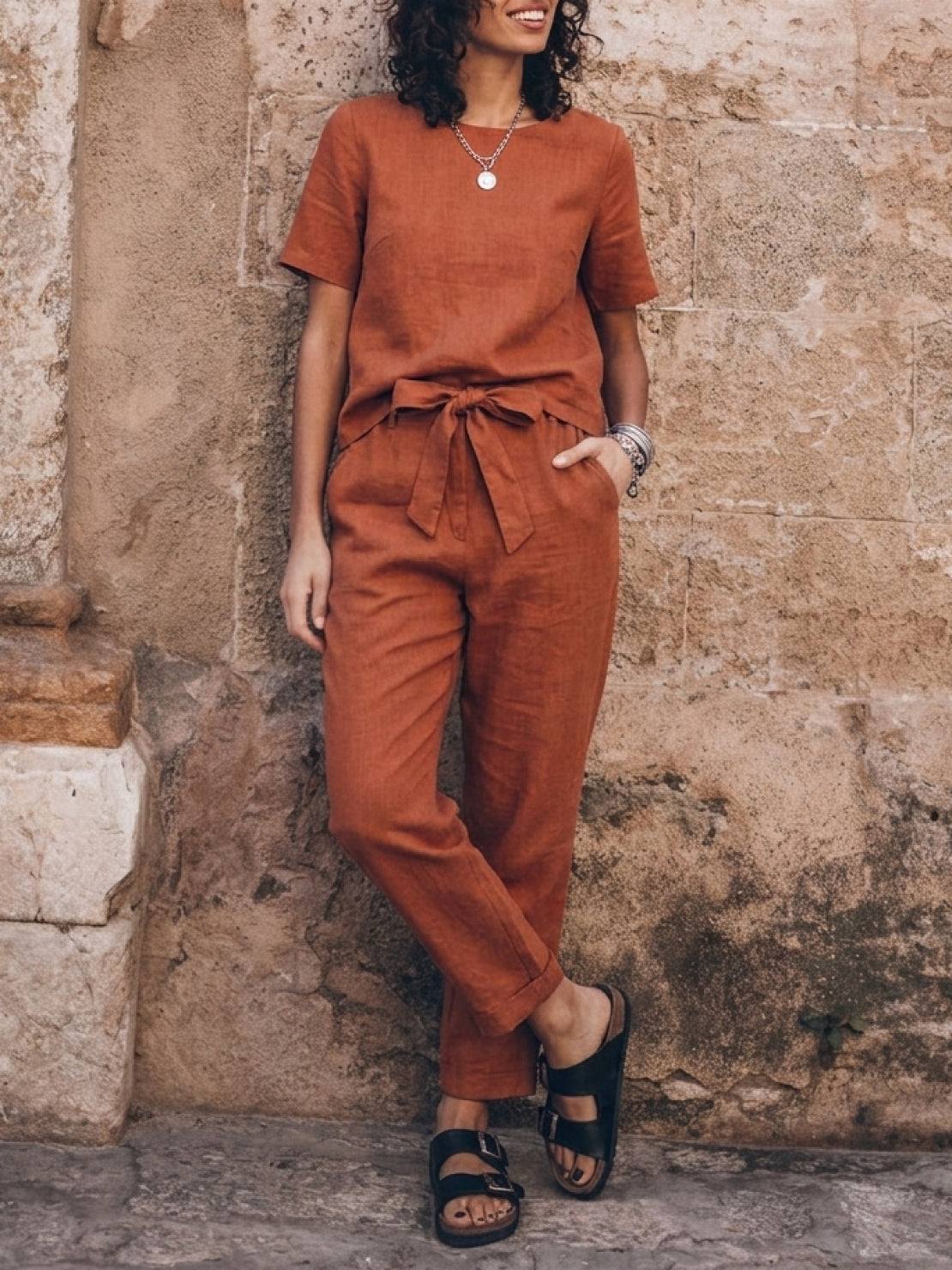woman wearing relaxed cotton-linen set with short-sleeve top and straight-leg pants in soft, breathable monochrome fabric