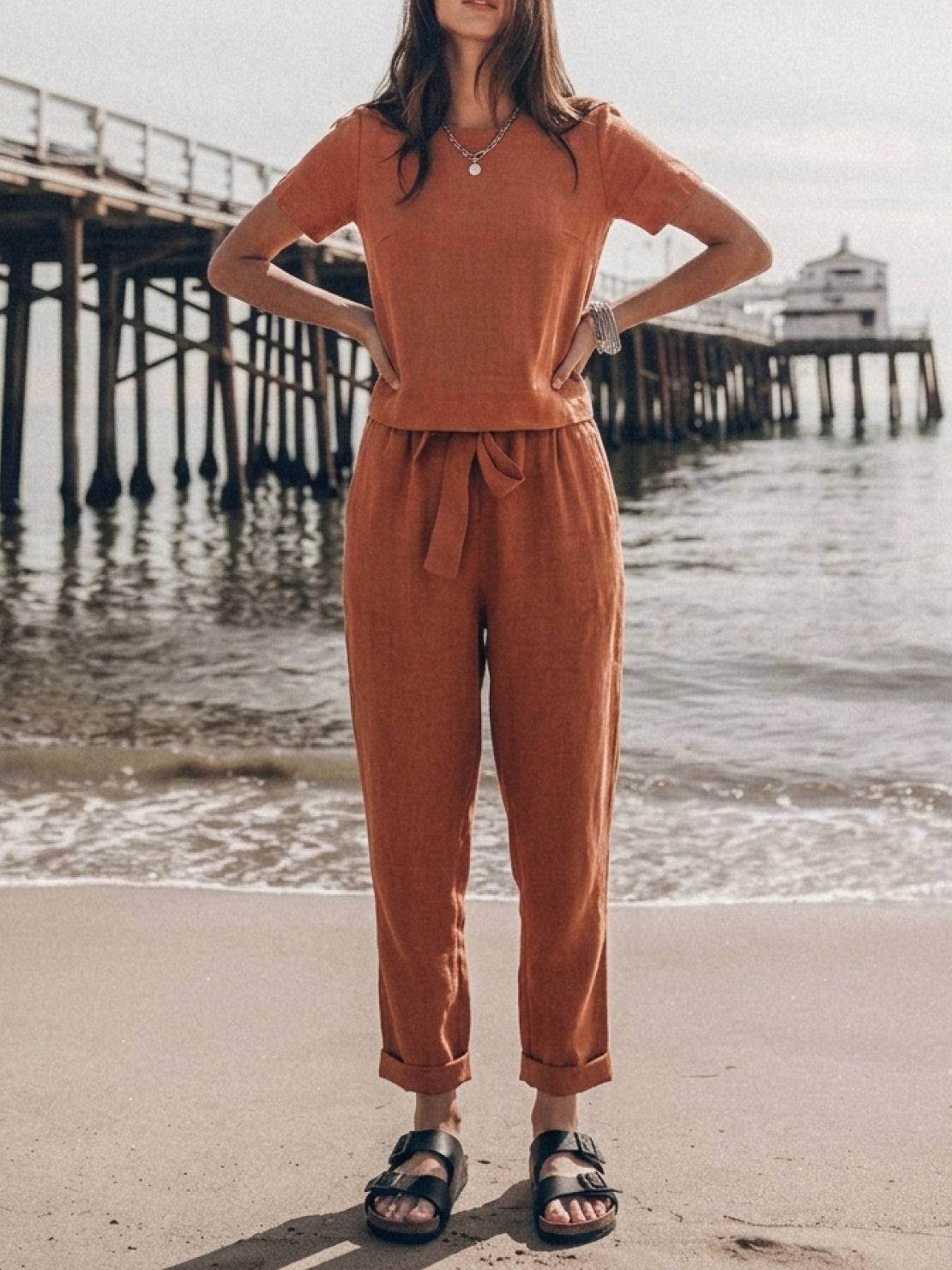 Woman wearing relaxed cotton-linen set with short-sleeve top and straight-leg pants in soft breathable fabric