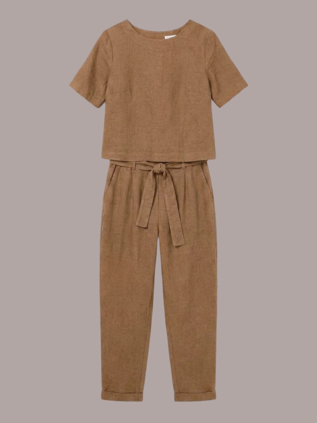 woman wearing relaxed cotton-linen set with short sleeve top and straight-leg pants in neutral monochrome tone