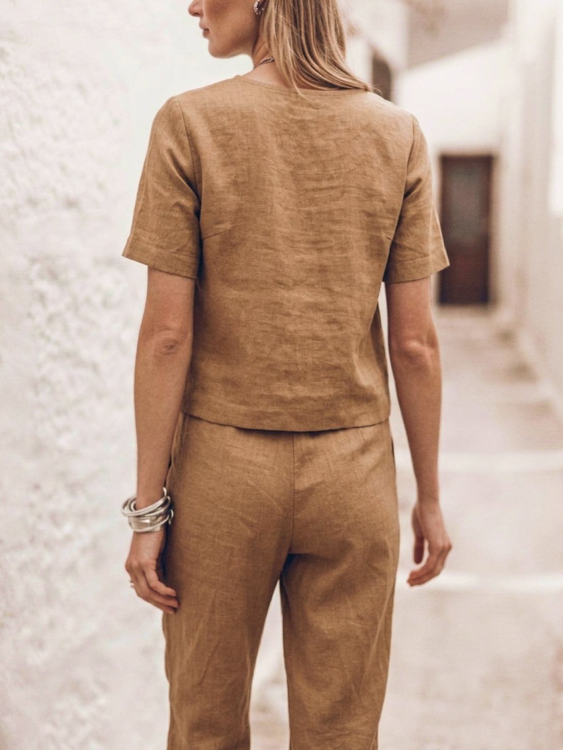 woman wearing relaxed cotton-linen set with short sleeve top and straight-leg pants in monochrome hues