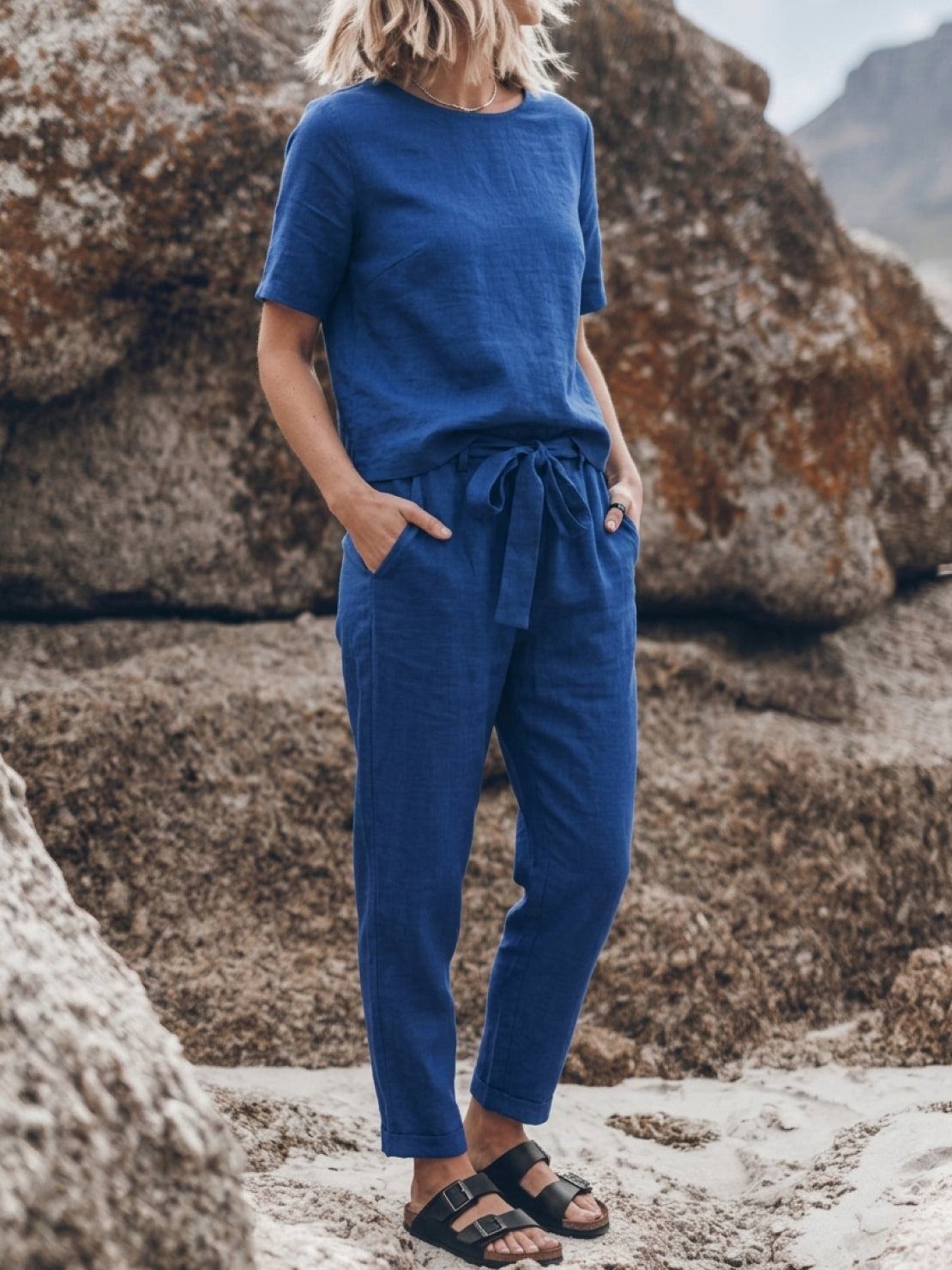 woman wearing relaxed cotton-linen set with short-sleeve top and straight-leg pants in soft monochrome tones