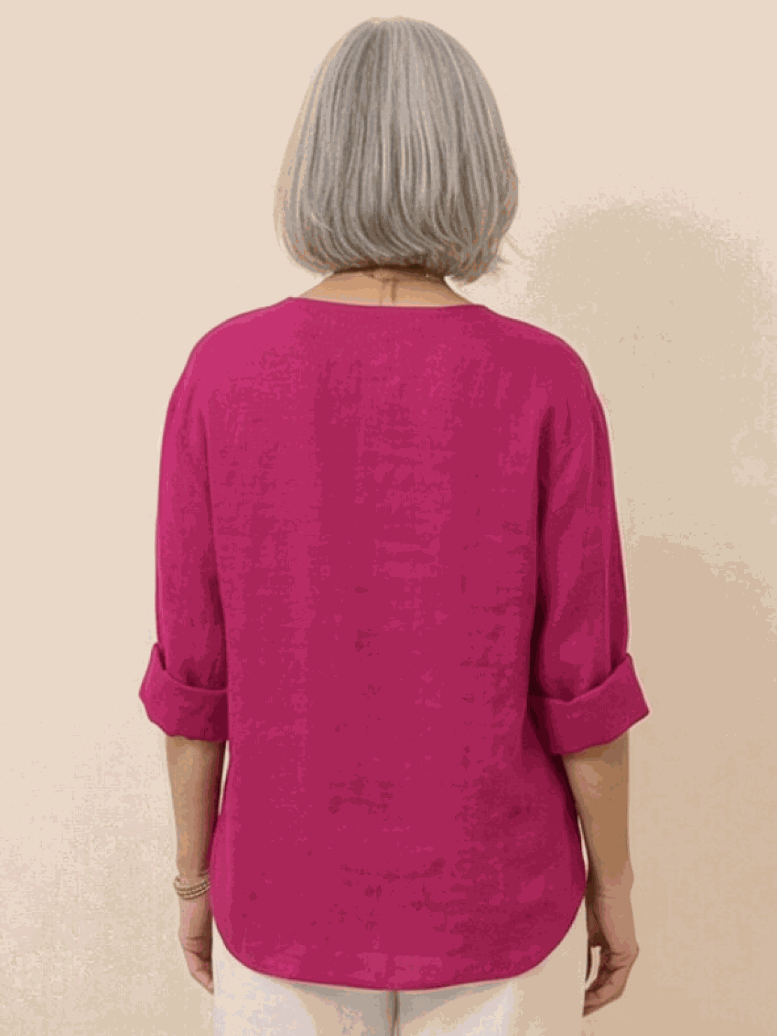 white pure linen age-defying shirt with button detail on wooden hanger