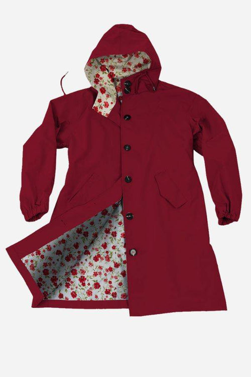 Red oversized Rain Couture Windbreaker with floral printed inner lining and adjustable hood.
