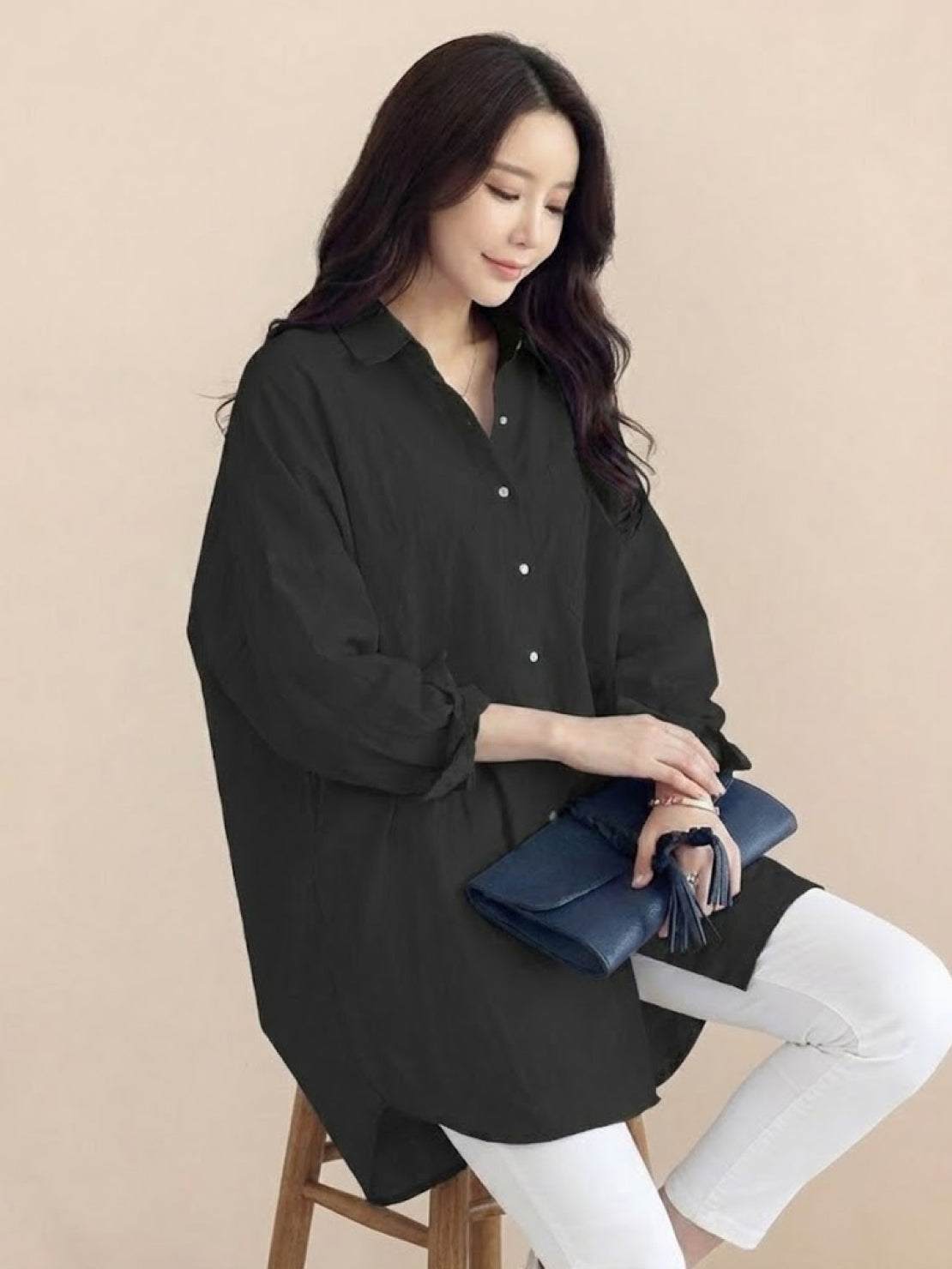 Oversized linen shirt in breathable cotton blend with relaxed fit and back button details