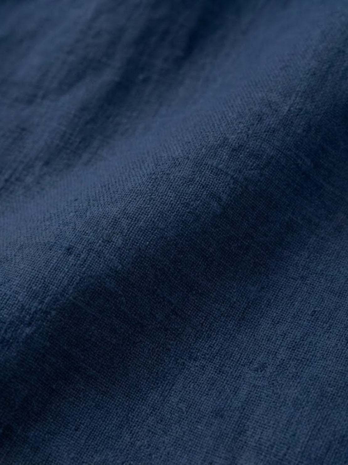 Close-up of soft breathable pure linen fabric in navy blue for Pure Linen Age-Defying Shirt