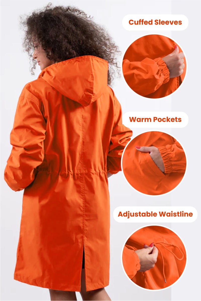 Orange Rain Couture Windbreaker with cuffed sleeves, warm pockets, and adjustable waistline, worn by woman from back view