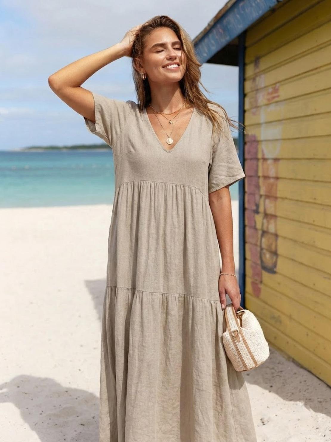 V-neck two-tiered maxi swing dress in flowy cotton fabric with irregular hemline and draped sleeves