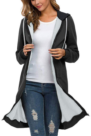 Black oversized long zip sweatshirt hoodie with fleece lining and hood, worn over white shirt and ripped jeans